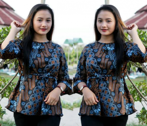 Kemeja kerja dengan desain batik atau motif tradisional Indonesia